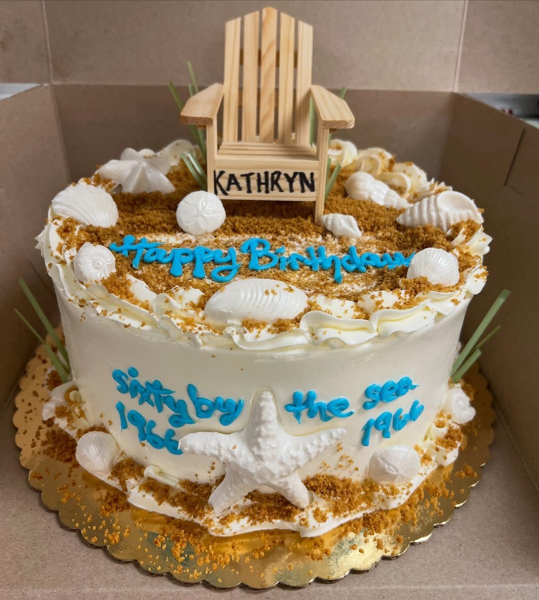 26 Beach Cake Ideas with Blue Ocean Frosting to Sailboats 24 Beach themed cake with brown sugar sand, white seashells, and a miniature beach chair.
