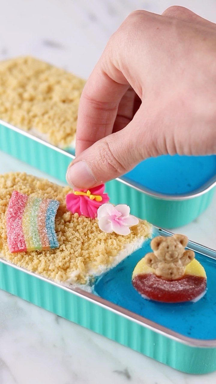 26 Beach Cake Ideas with Blue Ocean Frosting to Sailboats 22 Beach themed cake with graham cracker sand and a teddy bear float.