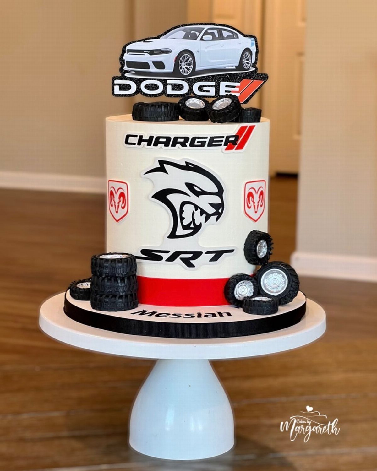 White Dodge Charger themed birthday cake with car cutout and edible tires.
