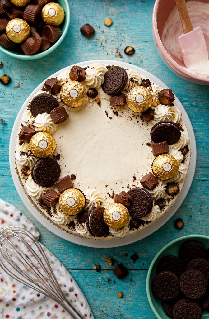 15 Simple Cake Decorating Ideas for 2026 — No Piping Required 8 A cake topped with various candies and cookies.